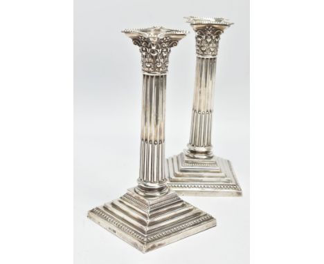 A PAIR OF LATE VICTORIAN SILVER CORINTHIAN COLUMN CANDLESTICKS, both with a shaped square removable sconce above a fluted and