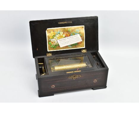 A  LATE 19TH CENTURY SWISS MUSIC BOX IN A ROSEWOOD STAINED CASE, the hinged lid pinned with a printed card label 'National Mu