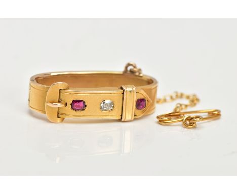 A LATE VICTORIAN GOLD, DIAMOND AND RUBY SCARF CLIP, of buckle design, set with an old cut diamond and a circular and oval cut