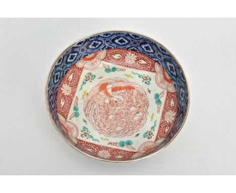 A 19TH CENTURY JAPANESE IMARI PORCELAIN BOWL, mounted with a hallmarked silver rim, the interior decorated with geometric and