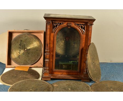 A LATE 19TH CENTURY WALNUT CASED FREESTANDING PENNY IN THE SLOT POLYPHON, the plinth top supported on two columns flanking an