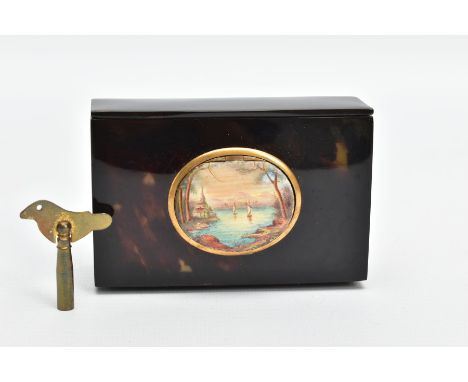 A 19TH CENTURY TORTOISESHELL SINGING BIRD AUTOMATON MUSIC BOX, the rectangular box with oval hinged enamelled cover painted w
