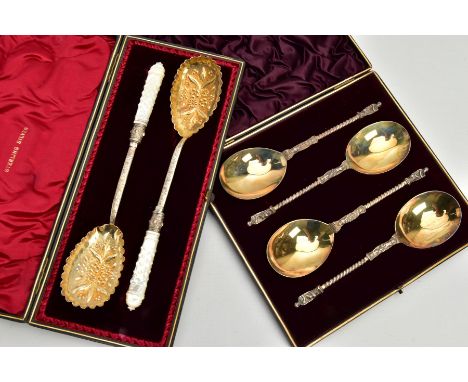 A CASED SET OF FOUR VICTORIAN SILVER APOSTLE TOP SPOONS, the case with gilt presentation inscription, the spoons with gilt bo