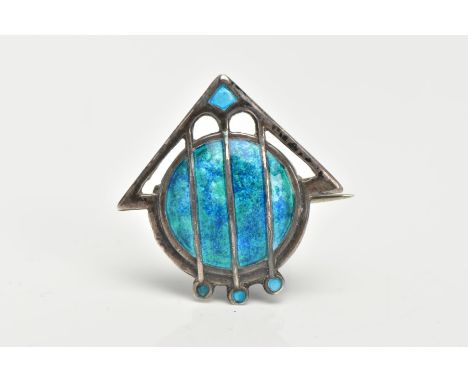 AN ART NOUVEAU SILVER ENAMEL BROOCH BY JAMES FENTON, a stylised arrow and shield decorated with blue and green enamel, measur