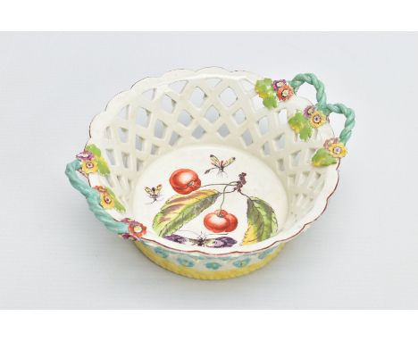 A DERBY PORCELAIN CIRCULAR BASKET, CIRCA 1760, each side with a pair of turquoise rope twist handles which terminate in flowe