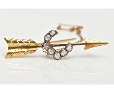 A DIAMOND ARROW BROOCH, designed as a crescent shape of seven old cut diamonds, attached to an arrow brooch, with safety chai