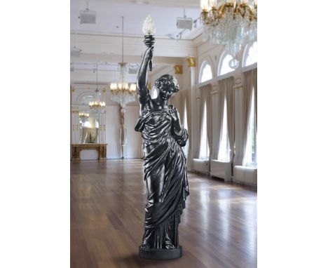 ‡ A FRENCH PAINTED CAST IRON FIGURAL TORCHERE  LATE 19TH CENTURY  Stamped 'Tusey Meuse', the maiden portrayed as standing and