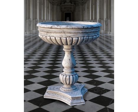 Ω A SCULPTED WHITE MARBLE PLANTER IN THE MANNER OF A CISTERN OR BASIN SECOND HALF 20TH CENTURY The basin with moulded sides a