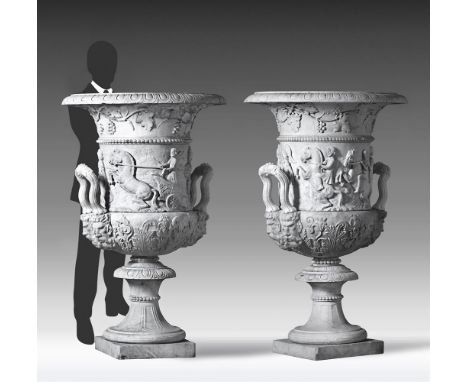 ‡ A PAIR OF MONUMENTAL ITALIAN SCULPTED WHITE MARBLE URNS IN THE MANNER OF THE MEDICI VASE LATE 19TH CENTURY Each with everte