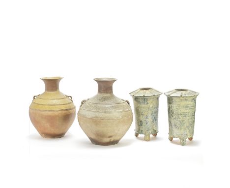 TWO STONEWARE OVOID VASES AND A PAIR OF GREEN-GLAZED GRANARIESHan DynastyComprising: two hu-shaped vases with three raised re