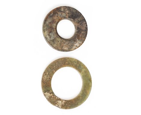 A JADE DISC, BI, AND A JADE RING, HUANWarring States/Han Dynasty or laterThe first of plain circular form, carved from a mott