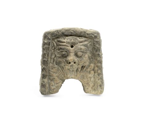A MOULDED CERAMIC TILEKorea, probably Silla DynastyMoulded in relief with mythical beast mask with bulging eyes and open mout