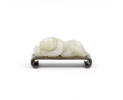 A WHITE JADE 'BOY AND CAT' GROUP19th centuryThe boy with a smiling face reclining on his right side whilst playing with a cat