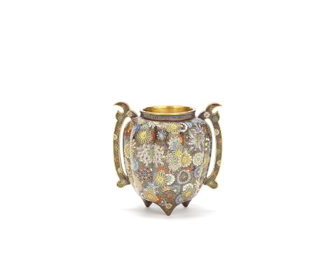 A SMALL JAPANESE CLOISONNÉ-ENAMEL 'MILLEFLEURS' JARMeiji PeriodThe lobed oviform vessel flanked by a pair of shaped handles a