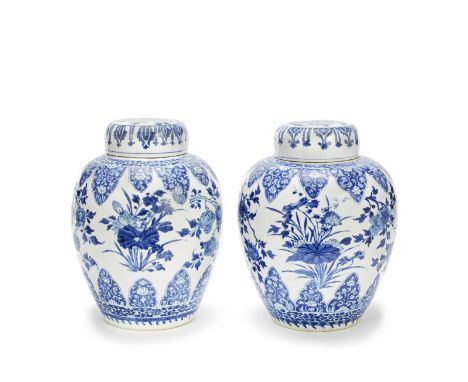 TWO BLUE AND WHITE GINGER JARS AND COVERSKangxiEach with a globular body, similarly decorated with alternating lotus flowers 