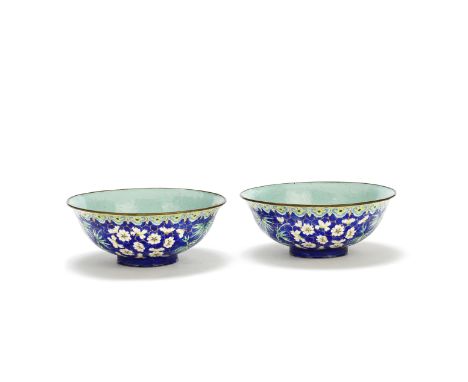 A PAIR OF PAINTED ENAMEL BOWLS19th centuryDecorated with prunus and bamboo on gilt and blue cracked-ice grounds, underneath b