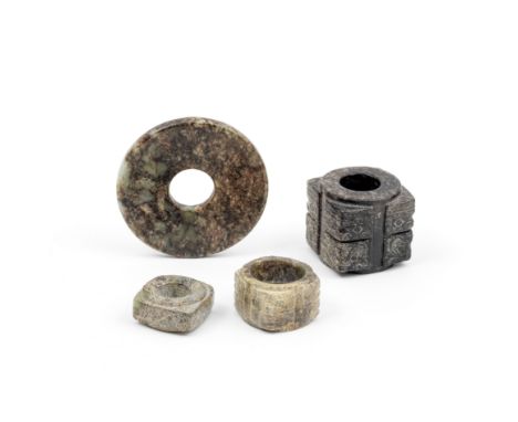 A GROUP OF FOUR ARCHAISTIC JADESProbably 19th/20th centuryComprising: a green jade Bi disc with brown, russet and creamy mott