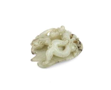A PALE GREEN AND BLACK JADE 'CHILONG' PLAQUE CARVING17th centuryThe pale stone carved in reticulation with a sinuous chilong 