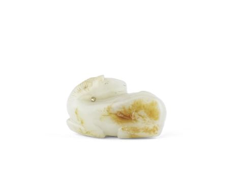 A PALE GREEN AND RUSSET JADE FIGURE OF A HORSE18th/19th centuryThe recumbent animal resting on its legs with the head turned 