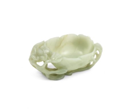 A GREEN JADE 'LOTUS' CUPQing DynastyThe deeply hollowed flowerhead supported by a network of leafy, flowering stems and flank