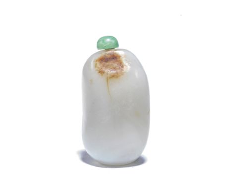 A PALE GREEN AND RUSSET JADE 'PEBBLE' SNUFF BOTTLELate Qing Dynasty The pale green pebble with traces of russet skin, the irr