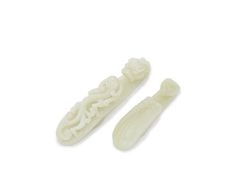 TWO PALE GREEN JADE BELT HOOKS18th/19th centuryA pale green jade with a dragon head hook and a high relief decoration with a 