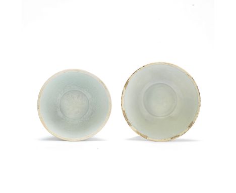 TWO QINGBAI BOWLSSong DynastyThe first moulded with a central medallion and six panels of flowering lotus and foliage to the 