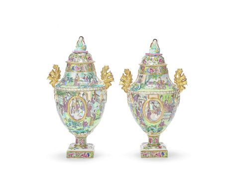 A PAIR OF 'CANTON' FAMILLE ROSE URNS AND COVERS19th centuryEach rising from a floral decorated square plinth and a short stem