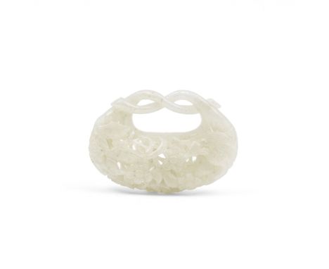 A WHITE JADE RETICULATED POUCH-FORM CARVINGQing DynastyCarved in openwork relief with exotic birds amongst a profusion of lea