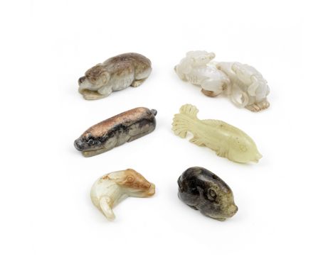 A GROUP OF JADE ANIMAL CARVINGSComprising: a Han-style carving of a pig; a greyish-brown jade carving of a recumbent dog; two