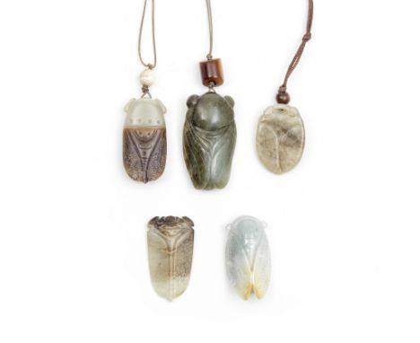A GROUP OF FIVE JADE CICADA PENDANTSEach carved in the form of cicadas with pronounced eyes, ribbed abdomen and wings folded 