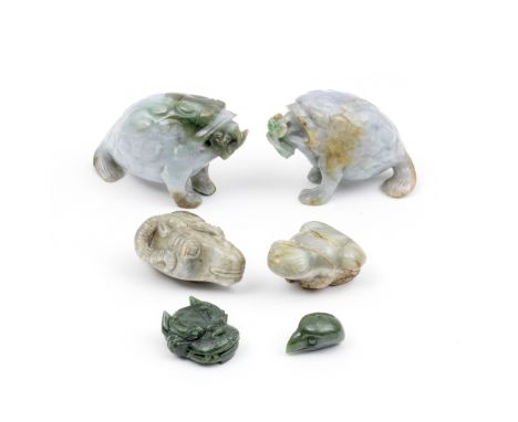 A GROUP OF SIX JADE AND JADEITE CARVINGSComprising: a pair of jadeite three-legged toads with lingzhi branches in their mouth