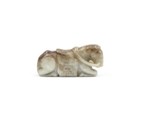 A PALE GREEN AND RUSSET JADE CARVING OF A RECUMBENT HORSEMing DynastyThe recumbent horse facing forwards with the head slight