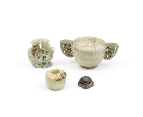 A GROUP OF THREE JADE VESSELS AND ONE SEAL17th/18th century and laterComprising: a yellow and russet jade globular brush wash