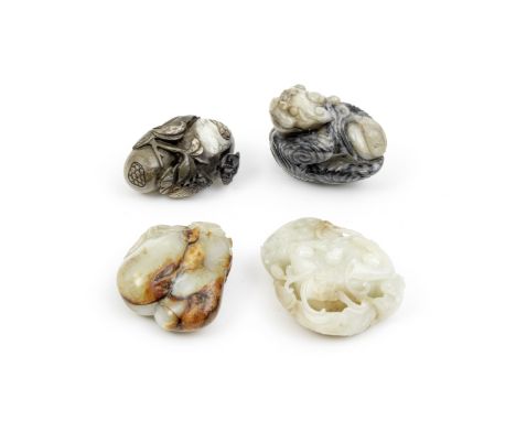 THREE JADE FRUIT GROUPS AND A MODEL OF A OF A LUDUANThe gourds, 17th/18th centuryComprising: a pale green and russet jade 'tw