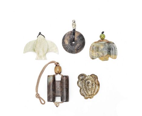 A GROUP OF FIVE ARCHAISTIC PENDANTSComprising: a brown jade ring pendant with S-shaped and geometrical decoration; a pale gre