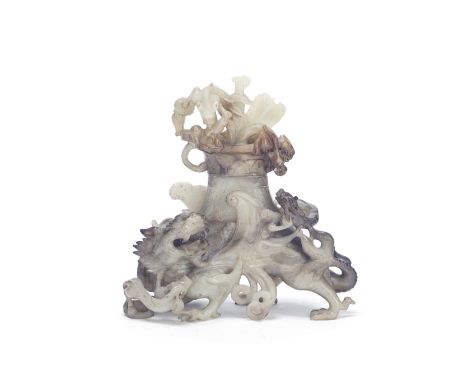 A black and white jade 'mythical beast' vase and coverLate Qing Dynasty/Republic PeriodThe cover with two chilong dragons, li