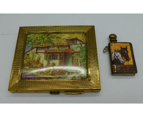 A lady's cigarette case and a brass and enamel lighter decorated with two horses