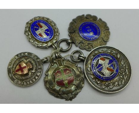 Five silver and enamel fobs, including football, 63g