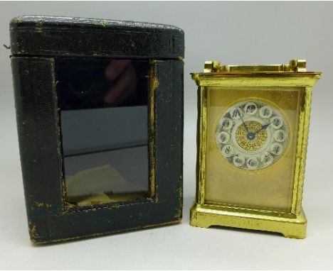 A French brass and four glass sided carriage clock in fitted case, height of clock 10.5cm