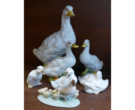 Three Nao duck figures, a Nao hen and chick figure and three other duck figures