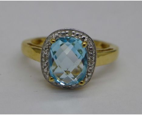 A silver gilt, topaz and diamond ring, R