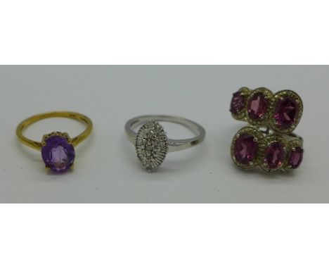 A silver set pink stone ring, an amethyst ring and a navette shape diamond ring, L, O and S