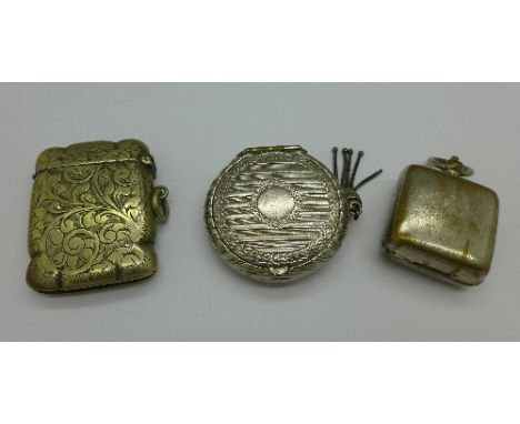 A plated sovereign holder, vesta case and a compact