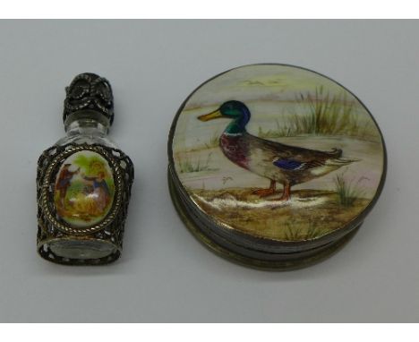 A silver and enamel box with mallard duck decoration and a small scent bottle