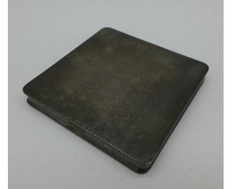 A white metal compact, tests as silver, 125.4g
