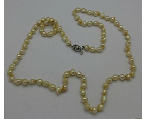 A set of baroque pearls on a sterling silver clasp