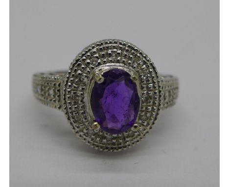 A 9ct white gold, amethyst and sixteen diamond ring, 3.4g, N