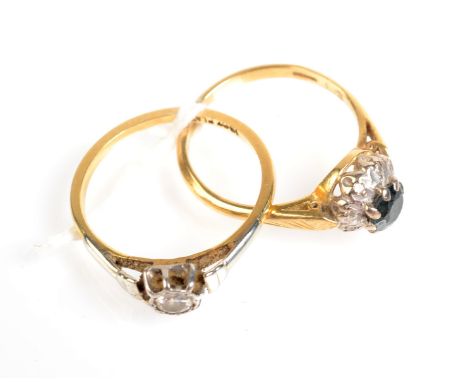 An 18ct. gold and platinum ring set with a diamond, and an 18ct. gold sapphire and diamond cluster ring.