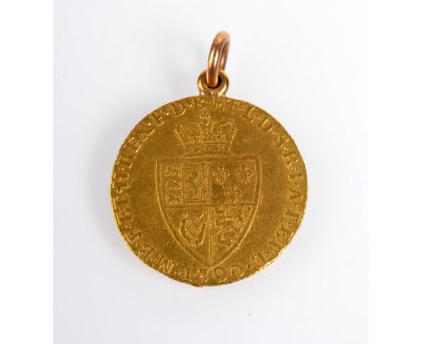 A George III spade guinea 1790, soldered ring mount, almost extremely fine, 9g.
